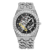Silver iced-out skeleton watch with crystal-studded band and bold modern design
