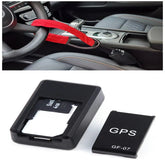 Red and black car anti-theft steering wheel lock and GPS tracker device on car seat