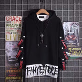 Black oversized streetwear hoodie with bold white graphic text and red lettering on sleeves