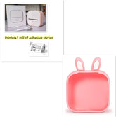 Compact white thermal label printer with USB cable, and a pink bunny-eared plastic tray