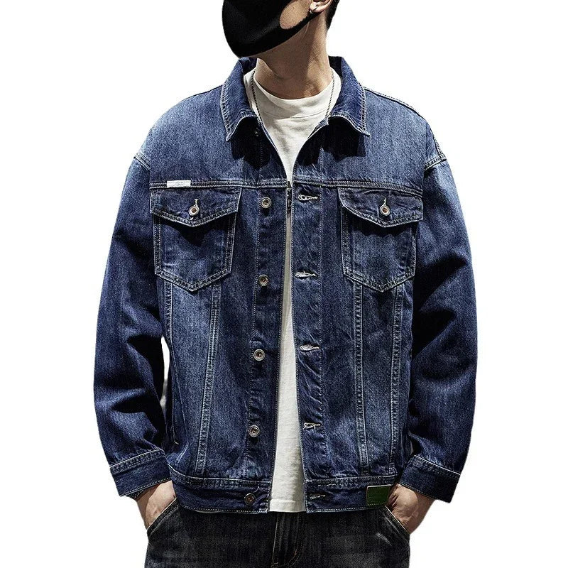 Men's blue denim jacket, relaxed fit, button closure, chest flap pockets, streetwear style