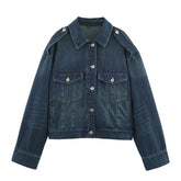 Dark blue denim jacket with button front, chest pockets, and relaxed fit