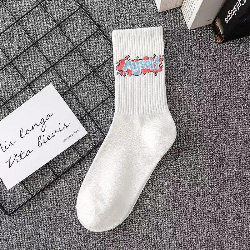 White ribbed crew sock with colorful graffiti text graphic, cotton blend, streetwear style