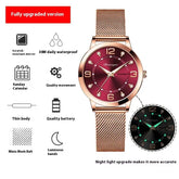 Rose gold mesh strap watch with red dial, luminous hands, and calendar display