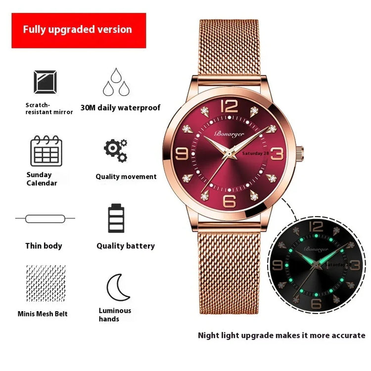 Rose gold mesh strap watch with red dial, luminous hands, and calendar display