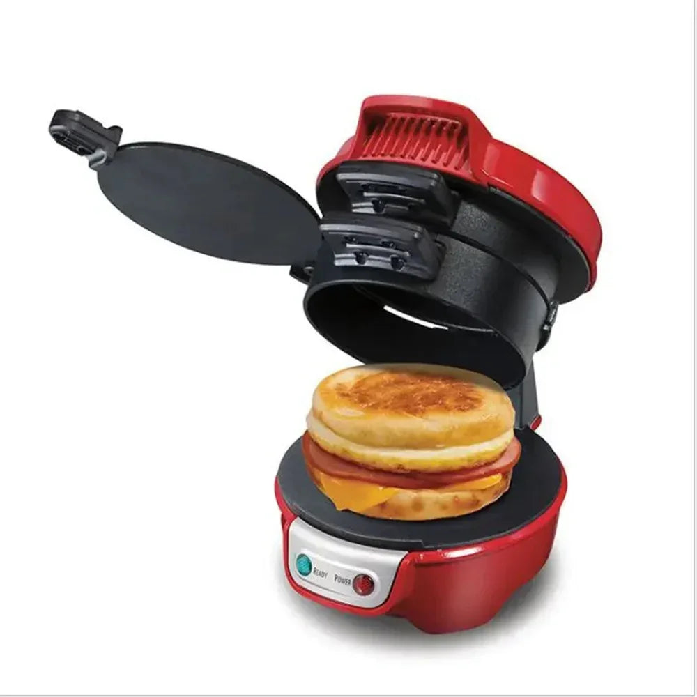 Red breakfast sandwich maker with open lid showing cooked egg, cheese, and meat on an English muffin