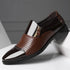 Brown perforated leather dress shoe with zipper closure and glossy accents, modern fit