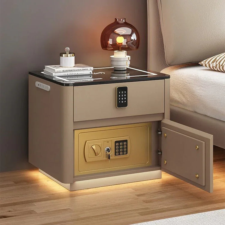 Modern beige nightstand with black glass top and built-in gold safe, wood floor, ambient lighting