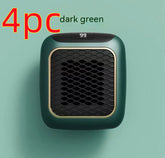 Compact dark green personal heater with digital display and honeycomb grille, modern design