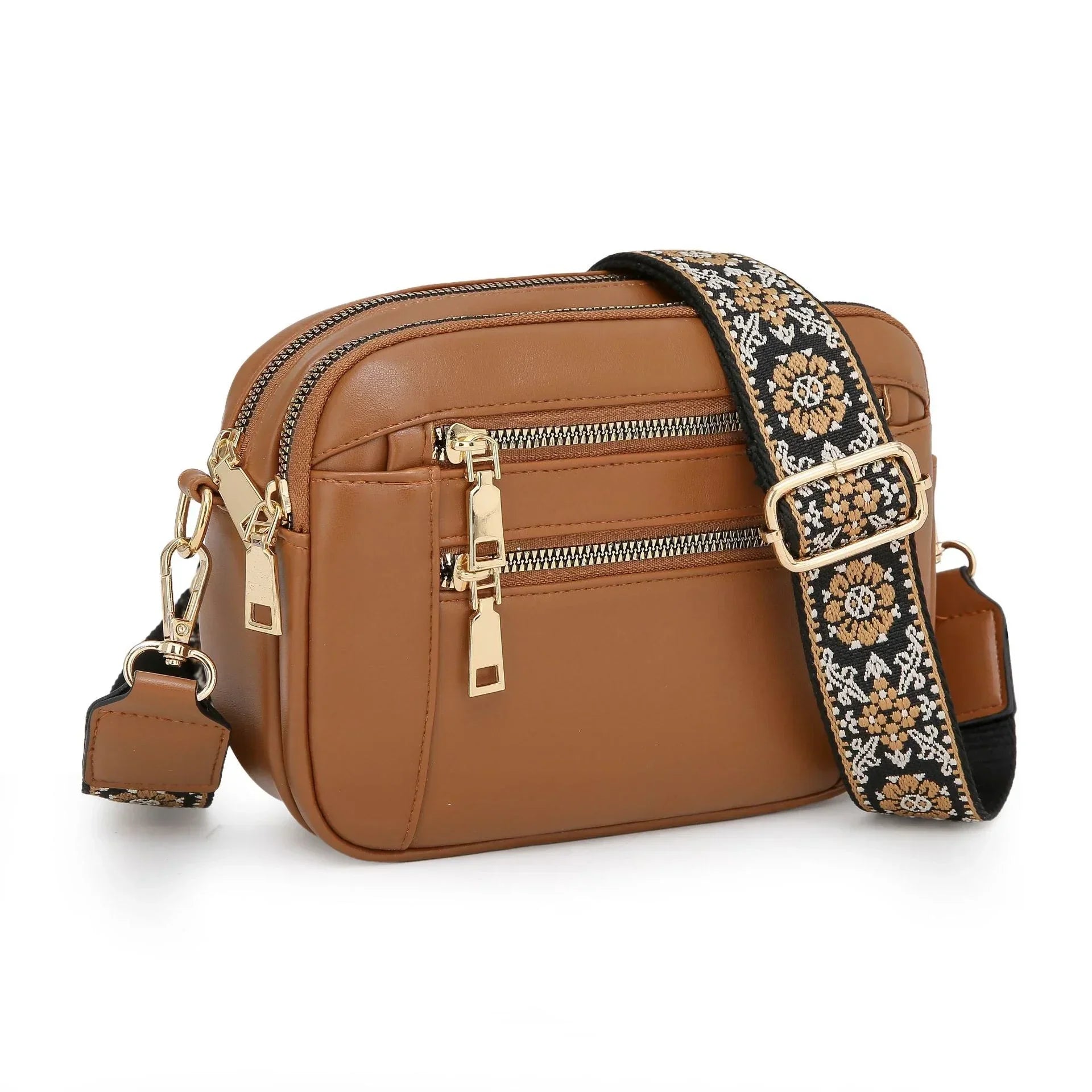 Brown faux leather crossbody bag with gold zippers and floral embroidered strap