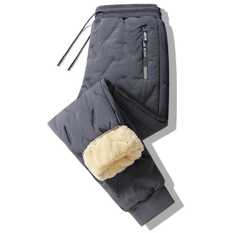 Dark gray quilted jogger pants with fleece lining, drawstring waist, and zippered pocket.