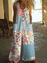 Woman wearing loose-fit patchwork floral and polka dot sleeveless jumpsuit outdoors