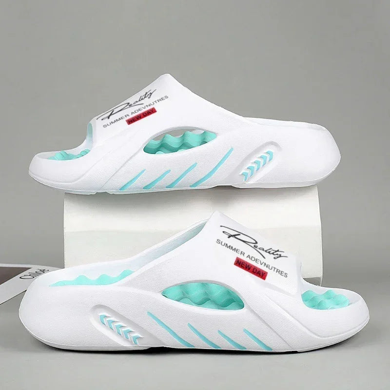 White slip-on foam slides with turquoise accents, open toe, sporty streetwear style, casual fit