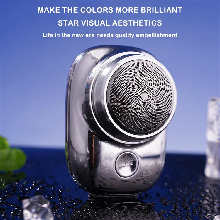 Sleek metallic portable speaker with circular grille, compact design, and glossy silver finish