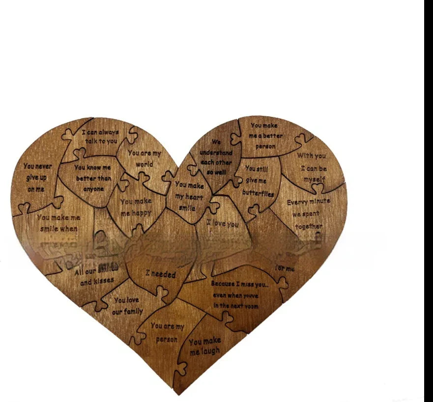 Heart-shaped wooden puzzle with engraved romantic messages on each piece, gift idea.