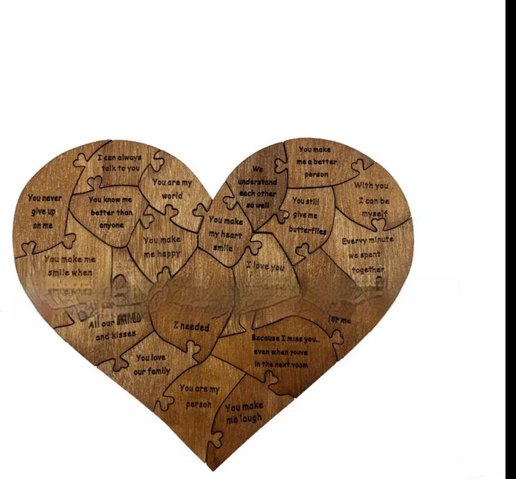 Heart-shaped wooden puzzle with engraved romantic messages on each piece, gift idea.