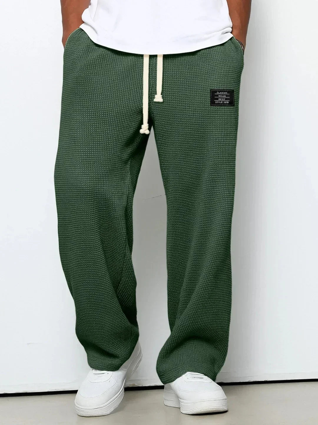 Green waffle knit relaxed fit sweatpants with drawstring waist and side pockets