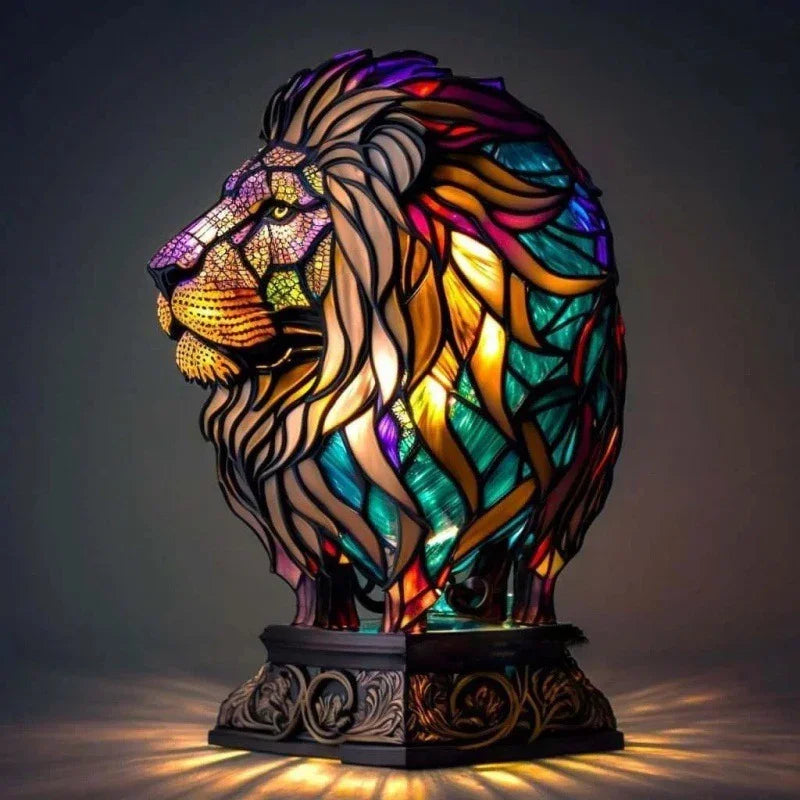 Multicolor stained glass lion lamp with intricate detailing, illuminated on ornate base.