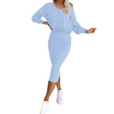 Woman wearing light blue off-shoulder long sleeve top and fitted midi skirt set
