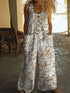 Woman wearing loose floral print linen jumpsuit with sleeveless design and wide legs