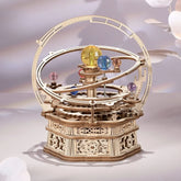 Wooden mechanical orrery model with colorful crystal planets on gears, decorative sci-fi display