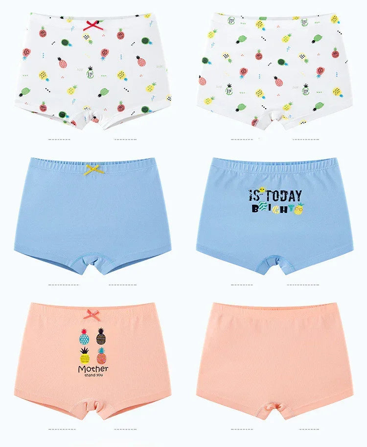 Assorted girls' cotton boyshort underwear in pastel colors with fun fruit prints and a snug fit