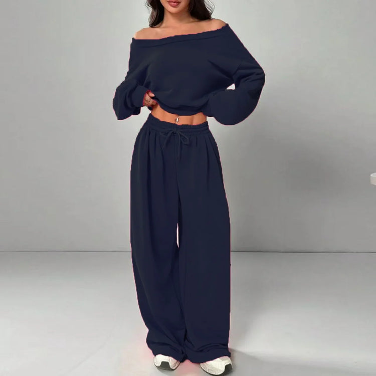 Woman wearing navy blue off-shoulder long sleeve top and wide-leg lounge pants set