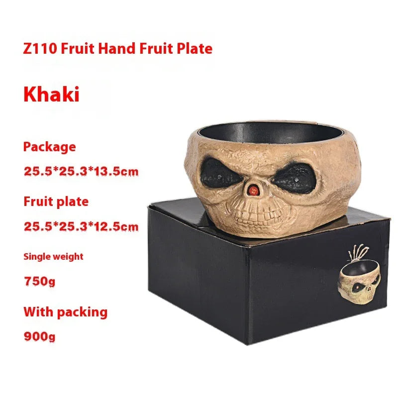 Khaki skull fruit plate bowl with black interior, made of textured material, shown on a black box.