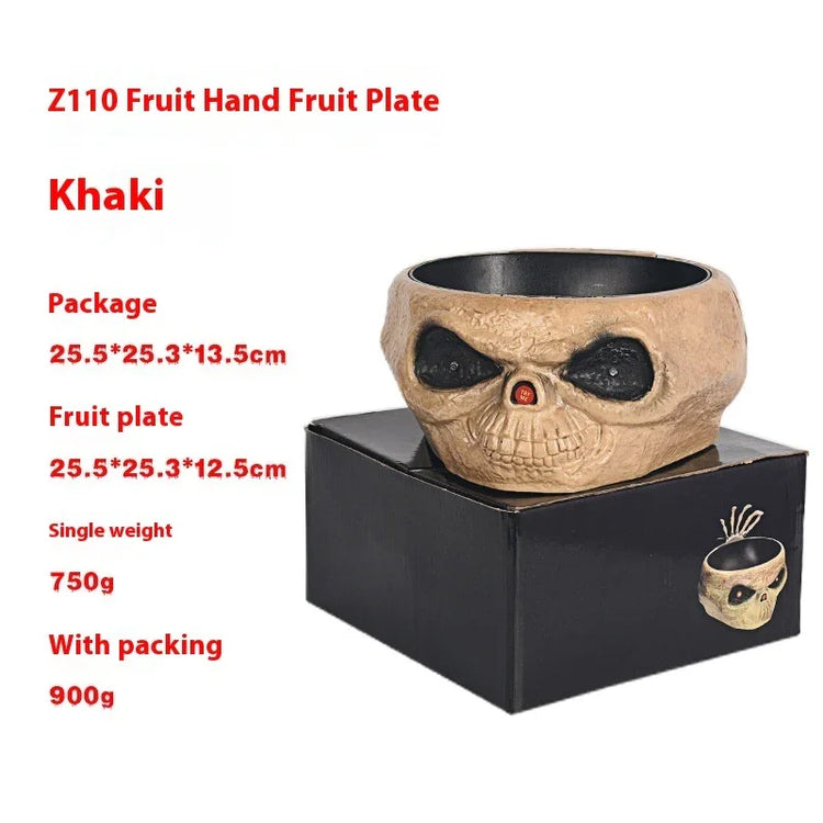 Khaki skull fruit plate bowl with black interior, made of textured material, shown on a black box.