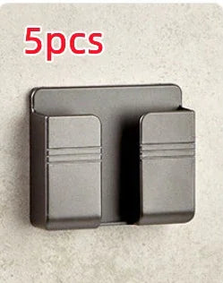 Matte black double wall hook, modern minimalist metal design, mounted on light stone wall
