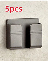 Matte black double wall hook, modern minimalist metal design, mounted on light stone wall