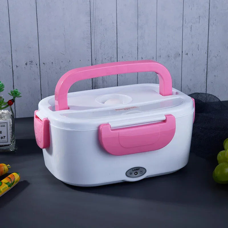 White and pink portable electric lunch box with handle and secure latches on tabletop