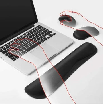 Black ergonomic wrist rests for keyboard and mouse on white desk with laptop