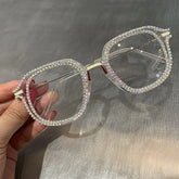 Oversized clear square eyeglasses with rhinestone-studded frames, glossy finish