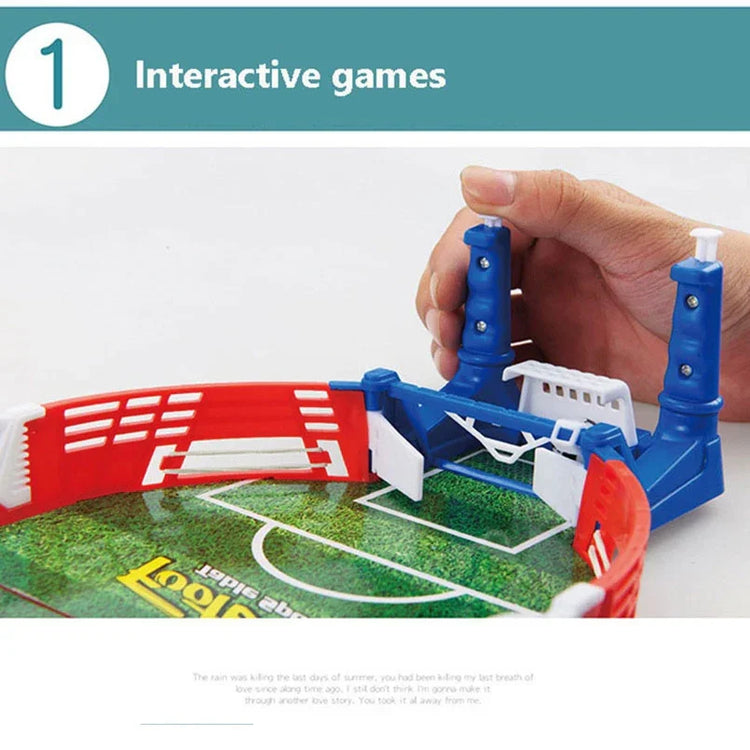Mini tabletop soccer game with red, white, and blue plastic parts, hand controlling lever.