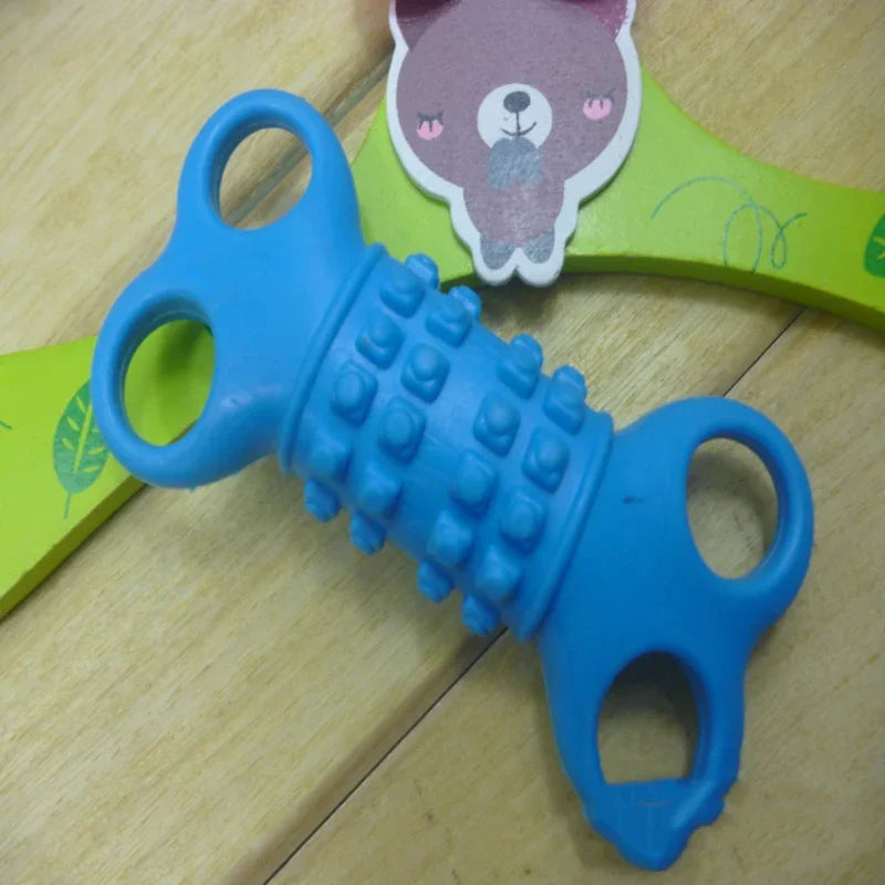 Blue textured plastic toy with knobby surface and handles on a wooden table