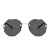 Geometric black rimless sunglasses with gold metal arms and nose bridge, modern streetwear style