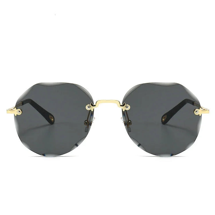 Geometric black rimless sunglasses with gold metal arms and nose bridge, modern streetwear style