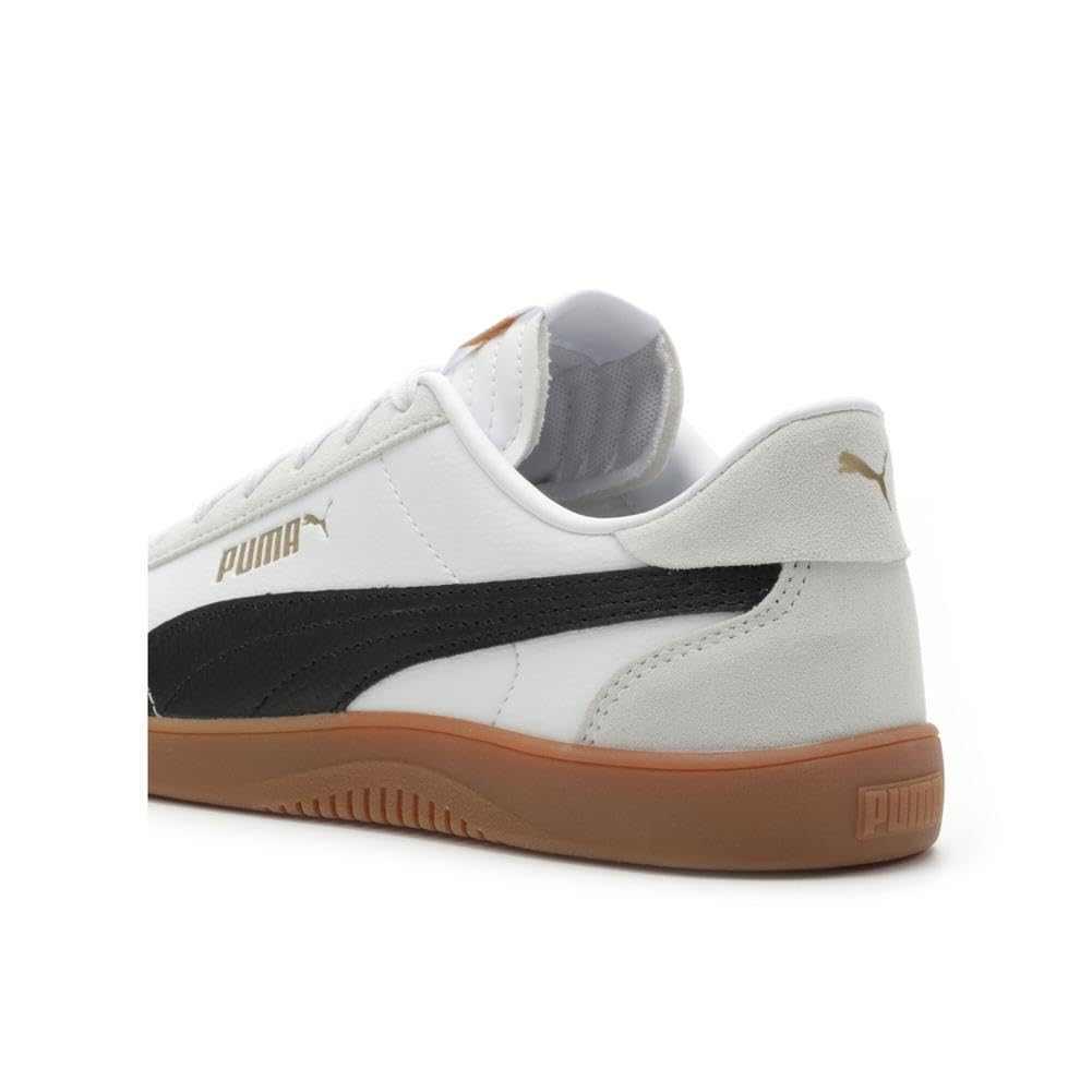 White low-top sneaker with black stripe, gum sole, suede heel, and gold accent details