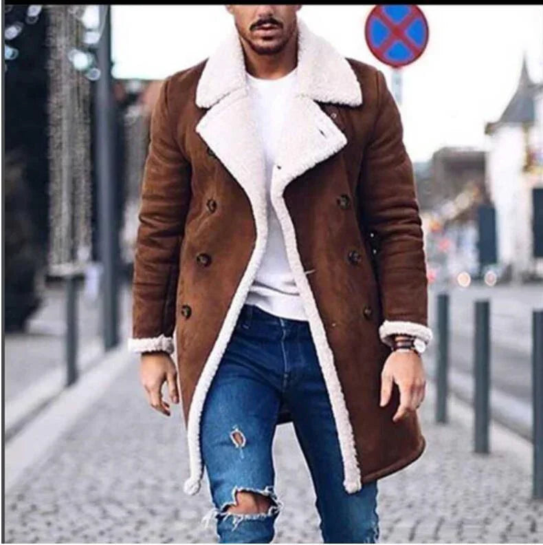 Man wearing brown shearling double-breasted coat, white shirt, and ripped blue skinny jeans