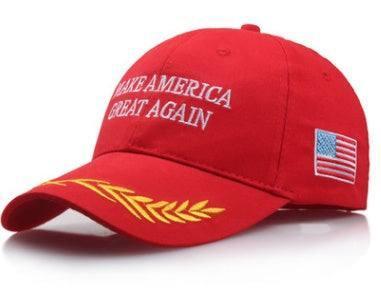 Red cotton baseball cap with white embroidered text, gold leaf detail on brim, and American flag patch