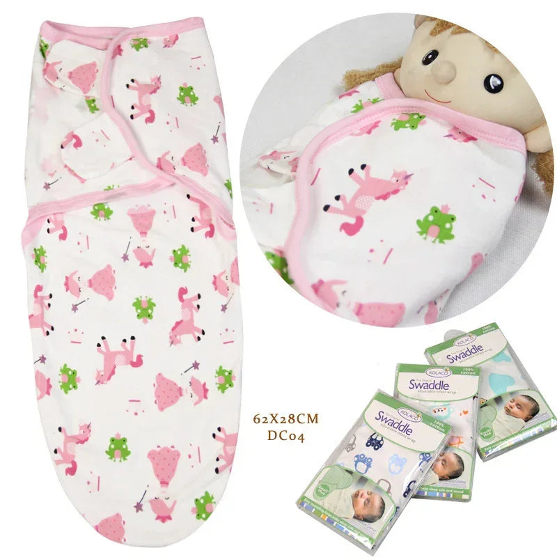 White cotton swaddle blanket with pink animal and green frog print, soft and adjustable fit.