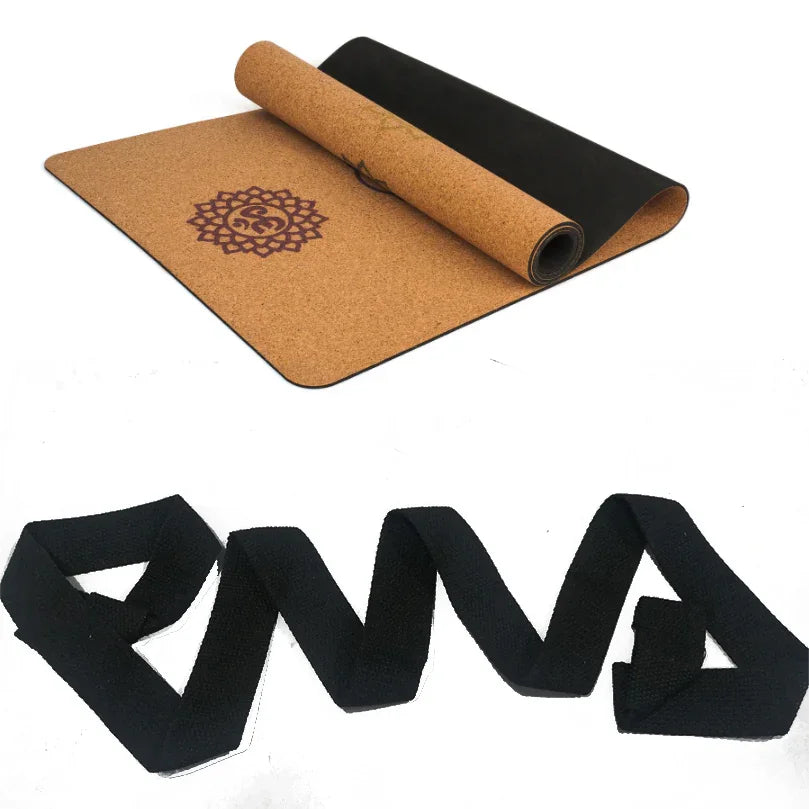 Eco-friendly cork yoga mat with mandala design and a black yoga strap, unrolled on white background.