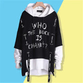 Oversized black and white layered hoodie with bold streetwear text and graphic details