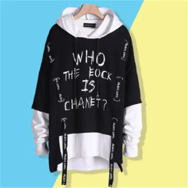 Oversized black and white layered hoodie with bold streetwear text and graphic details