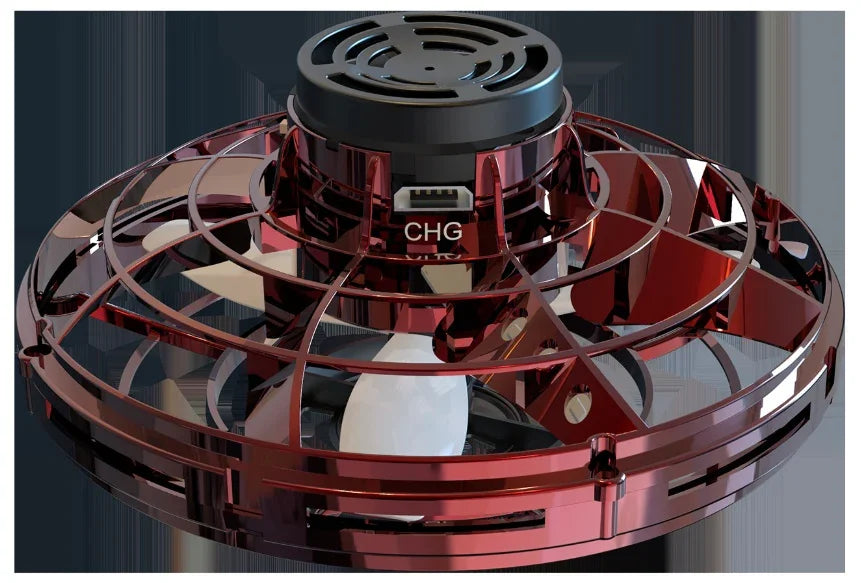 Close-up of a red plastic mini drone with caged propeller and USB charging port
