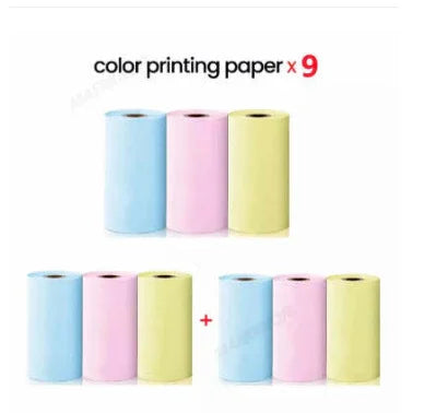 Set of nine pastel blue, pink, and yellow color printing paper rolls for printers