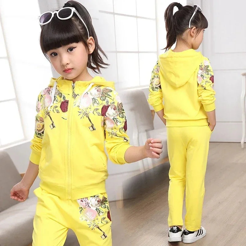 Girl wearing yellow floral hoodie and matching joggers, casual fit, soft fabric
