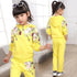 Girl wearing yellow floral hoodie and matching joggers, casual fit, soft fabric