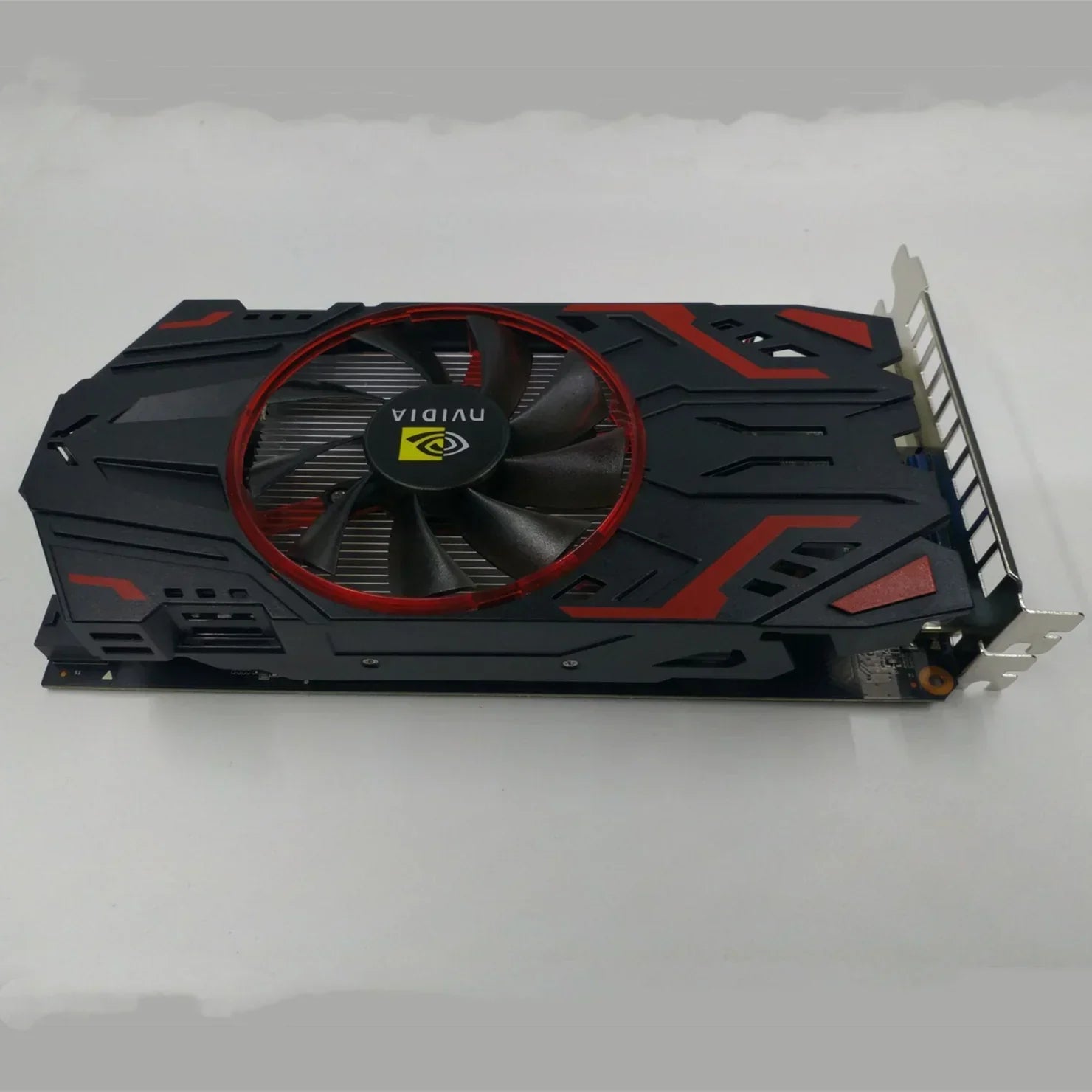 Black and red tech graphic card with single large cooling fan, futuristic design